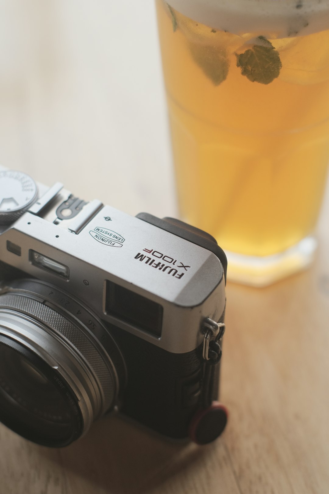 Camera and film equipment laid out on a wooden table